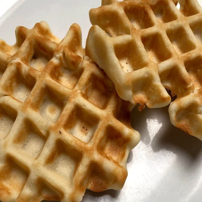 Golden, crisp-edged Belgian waffles on a plate
